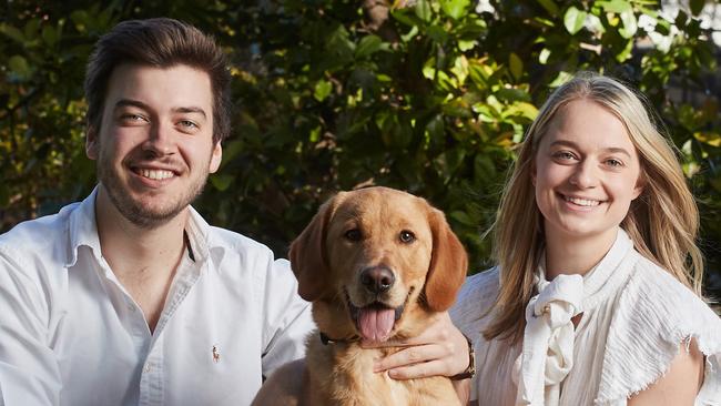 Jack Batty and Charlotte Thomas with dog Trooper. AAP Image/MATT LOXTON