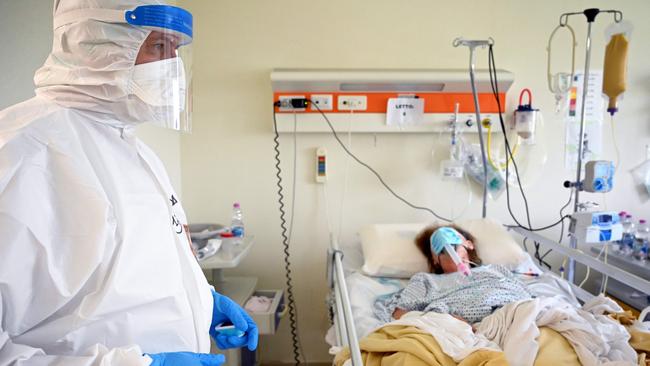Italian anaesthesiologist Marino De Rosa takes care of a patient at the ICU of the COVID unit where he works at the San Filippo Neri hospital in Rome.