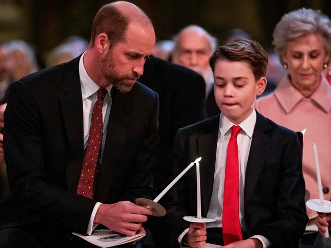 Prince William, Prince of Wales (L) and Prince George attend the 