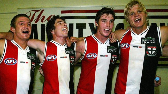 Four St Kilda favourites – Steven Baker, Stephen Milne, Lenny Hayes, and Nick Riewoldt – celebrate a win.