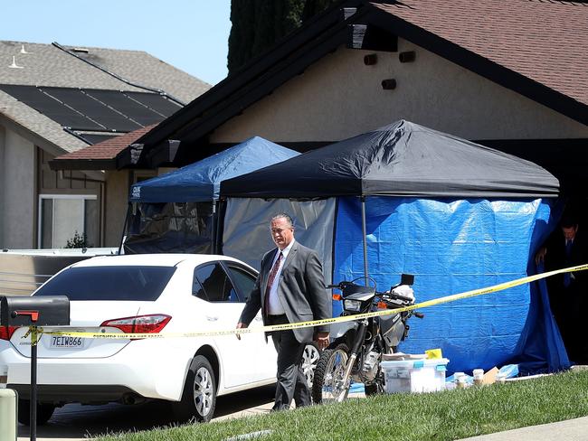 Law enforcement officials leave the home of accused rapist and killer Joseph James DeAngelo. Picture: Justin Sullivan.