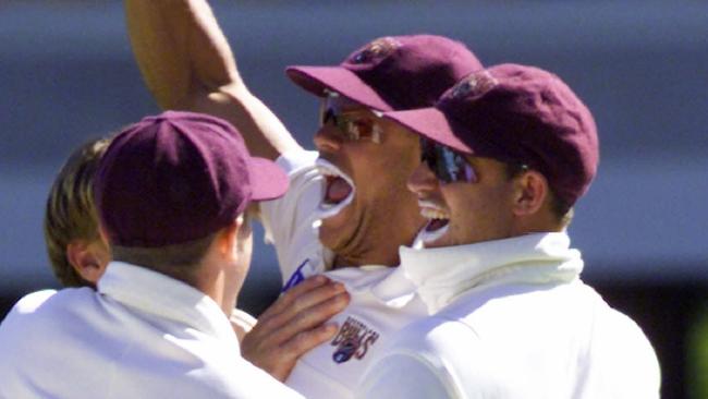 19Dec99. Cricket. Pura Milk Cup at the Gabba, Brisbane. Queensland v Victoria. Queensland's Andrew Symonds pumps his fist in jubilation after taking a sensational catch to dismiss Darren Berry.   f/l/Cricket