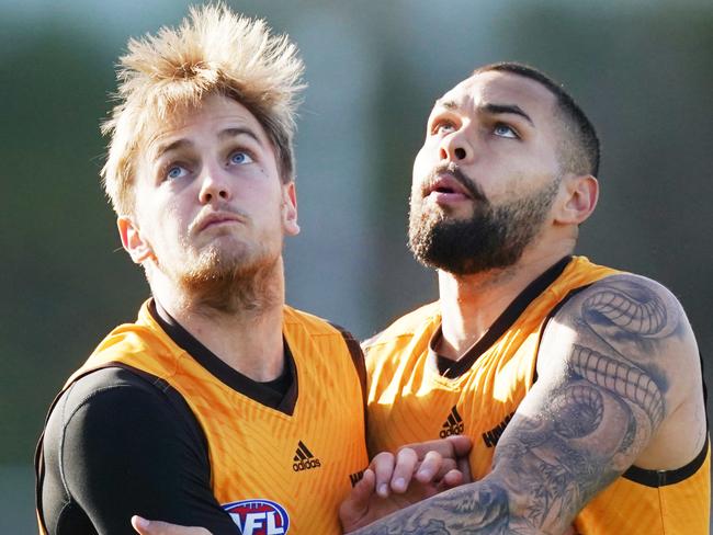 Harry Morrison of the Hawks (left) competes for the ball against Jarman Impey of the Hawks during an AFL Hawthorn Hawks training session at Waverley Park in Melbourne, Friday, June 26, 2020. (AAP Image/Michael Dodge) NO ARCHIVING