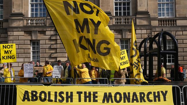 The protesters jeered as the royals passed by. (Photo by Danny Lawson – Pool/Getty Images)