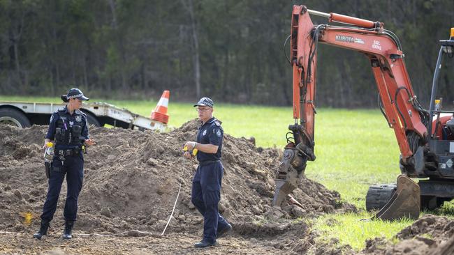 Police are seen scouring dug up earth near Morayfield road in Burpengary, north of Brisbane. Picture: AAP Image/Glenn Hunt