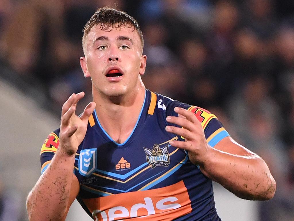 Jai Whitbread of the Titans receives the ball during the Round 14 NRL match between the Gold Coast Titans and the New Zealand Warriors at CBus Super Stadium on the Gold Coast, Friday, June 14, 2019.  (AAP Image/Dave Hunt) NO ARCHIVING, EDITORIAL USE ONLY