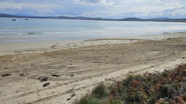 A photo released by Tasmania Police showing churned up sand from hooning on Cloudy Bay Beach, Bruny Island in 2024.