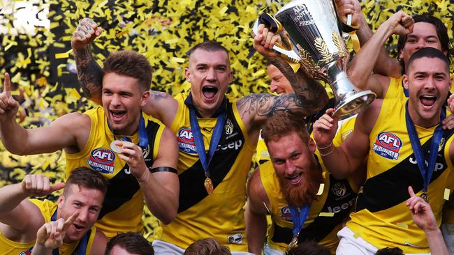 Norm Smith Medallist Dustin Martin soaks up Richmond’s drought-breaking flag. Picture. Phil Hillyard