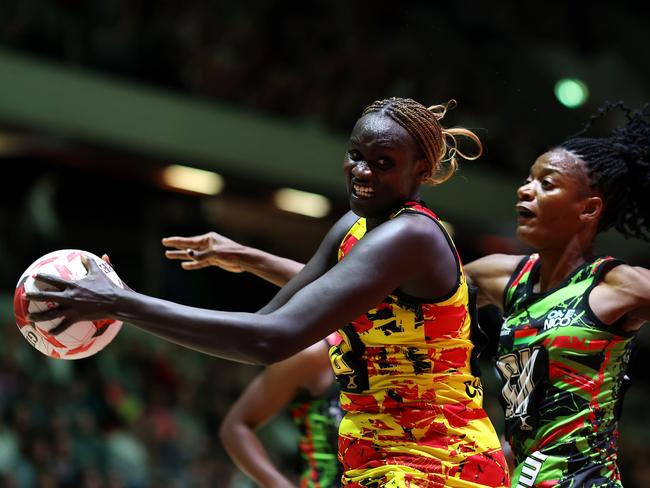 LONDON, ENGLAND - FEBRUARY 09: Mary Nuba Cholhok of Uganda beats Malawi's Tendai Masamba to the ball during Vitality Netball Nations Cup Third Place Play-off match between Malawi and Uganda at Copper Box Arena on February 09, 2025 in London, England. (Photo by Charlie Crowhurst/Getty Images for England Netball)