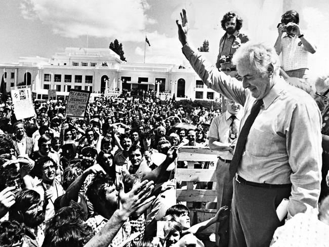 NOVEMBER 12, 1975 : Ousted PM Gough Whitlam outside federal parliament in Canberra 12/11/75 waving to supporters day after government dismissed by GG Kerr. Pic Ross Duncan.