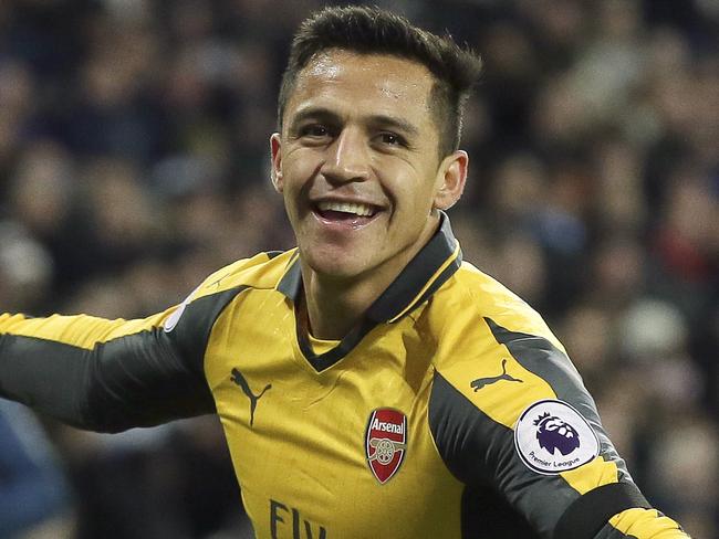 Arsenal's Alexis Sanchez celebrates after scoring a goal during the English Premier League soccer match between West Ham United and Arsenal at The London Stadium in London, Saturday Dec. 3, 2016. (AP Photo/Tim Ireland)