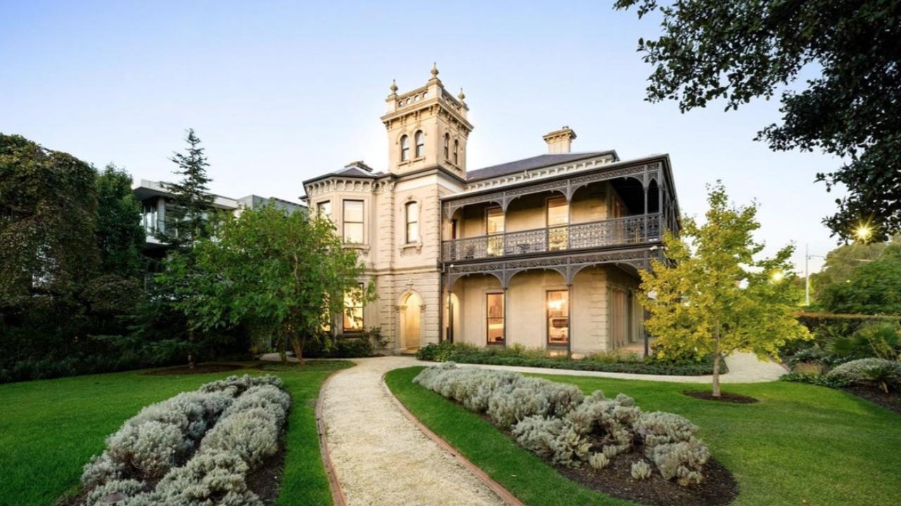 The grand facade of Cumnock in Parkville, designed by Windsor Hotel architect Charles Webb, features Corinthian columns, a tower and park-facing frontage