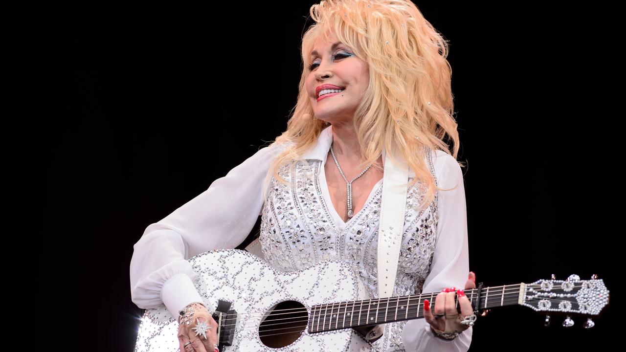 Dolly Parton always wears sleeves. Always. Picture: AFP / Leon Neal