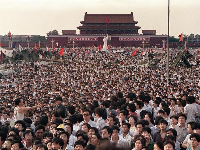 Hundreds of thousands of Chinese people gather around a 10m replica of the Statue of Liberty (c), called the Goddess of Democracy, in Tiananmen Square demanding democracy despite martial law in Beijing 02 Jun 1989. Hundreds, possibly thousands, of protesters were killed by China's military on 03 and 04 Jun 1989, as communist leaders ordered an end to six weeks of unprecedented democracy protests in the heart of the Chinese capital. Dissidents and human rights advocates around the world will mark 04 Jun 2009 the twentieth anniversary of China's bloody crackdown on the pro-democracy protests. (AFP PHOTO/FILES/CATHERINE HENRIETTE)