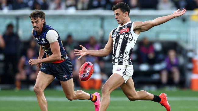 MELBOURNE, AUSTRALIA - MAY 18: Nick Daicos of the Magpies kicks during the round 10 AFL match between Collingwood Magpies and Kuwarna (the Adelaide Crows) at Melbourne Cricket Ground, on May 18, 2024, in Melbourne, Australia. (Photo by Quinn Rooney/Getty Images)