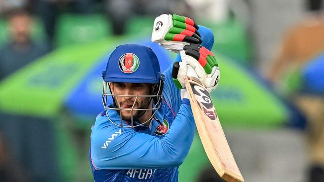 Afghanistan's Azmatullah Omarzai plays a shot during the ICC Champions Trophy one-day international (ODI) cricket match between Australia and Afghanistan at the Gaddafi Stadium in Lahore on February 28, 2025. (Photo by Aamir QURESHI / AFP)