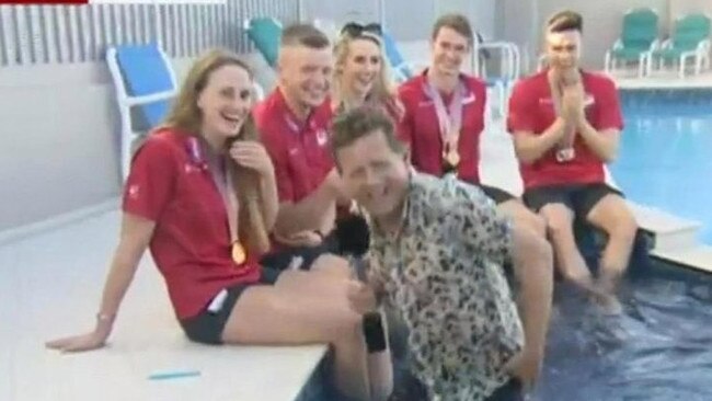 BBC presenter Mike Bushell suffered the hilarious misfortune of falling into a swimming pool live on air while interviewing Commonwealth Games swimmers