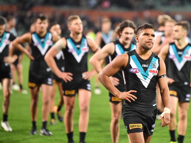 Port players after the AFL first elimination final match between the Port Adelaide Power and West Coast Eagles at the Adelaide Oval in Adelaide, on Saturday, September 9, 2017. (AAP Image/David Mariuz) NO ARCHIVING, EDITORIAL USE ONLY