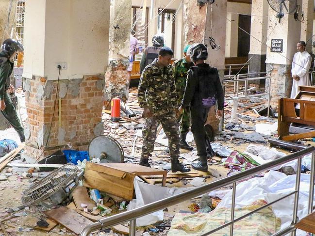 Security forces inspect damage inside St. Anthony's Shrine. Picture: Getty Images