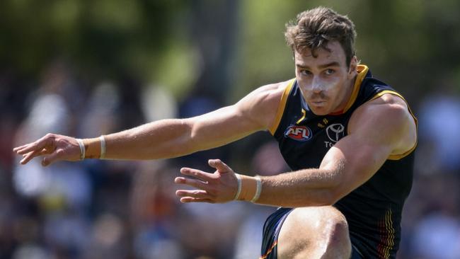 ADELAIDE, AUSTRALIA - MARCH 02:  Riley Thilthorpe of the Crows kicks during the 2024 AFL Community Series match between Adelaide Crows and West Coast Eagles at Hisense Stadium on March 02, 2024 in Adelaide, Australia. (Photo by Mark Brake/Getty Images)