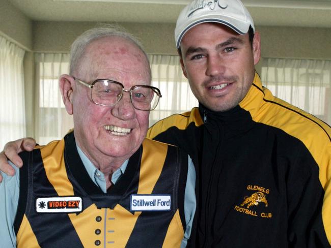 Murray Whittaker, who played in Glenelg’s first flag in 1934, with then Tigers footballer Heath Culpitt in 2004.