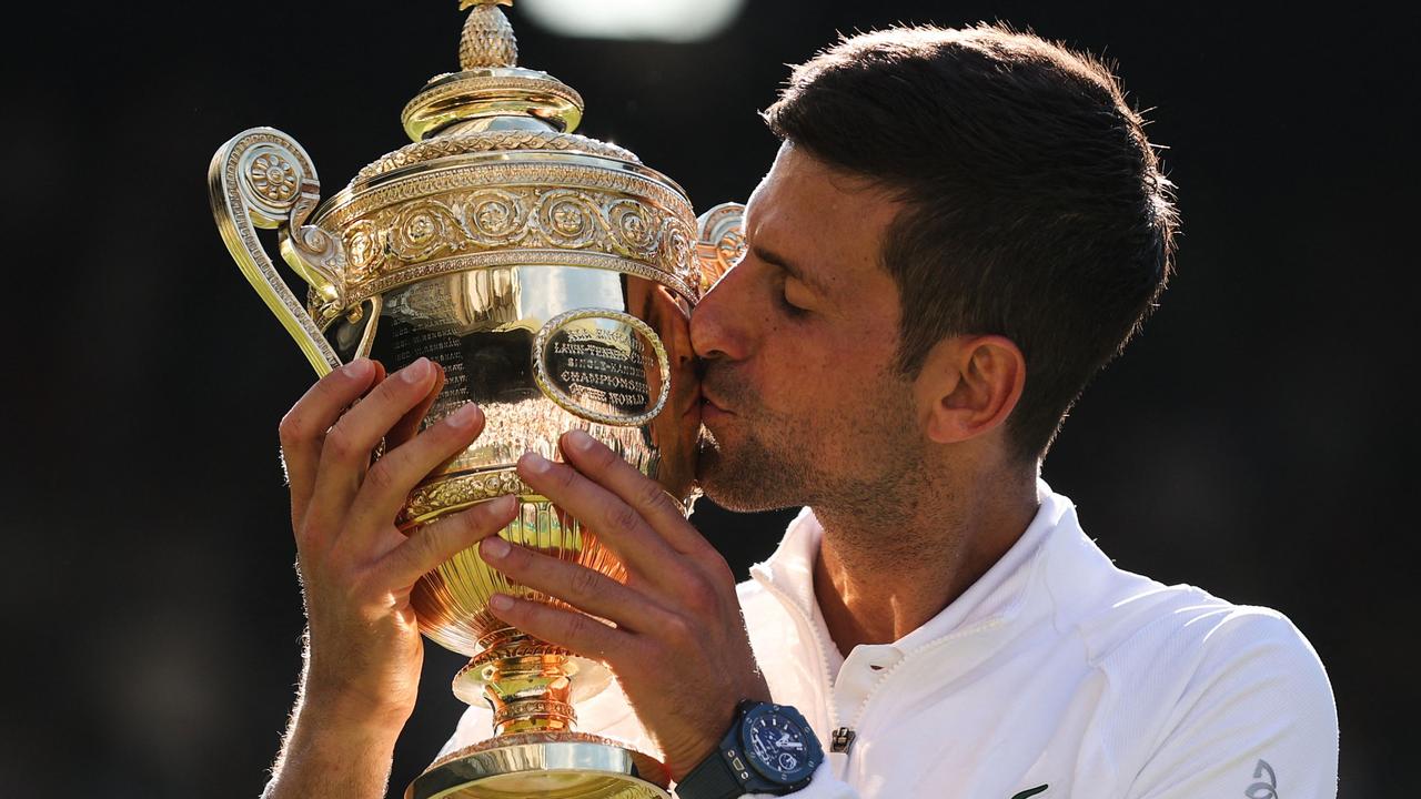 Victory tastes so sweet. (Photo by Adrian DENNIS / AFP)