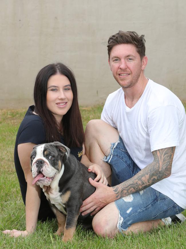 Biggie Smalls is happy to be home with Kayla Johnson and Phil Street. Picture Glenn Hampson