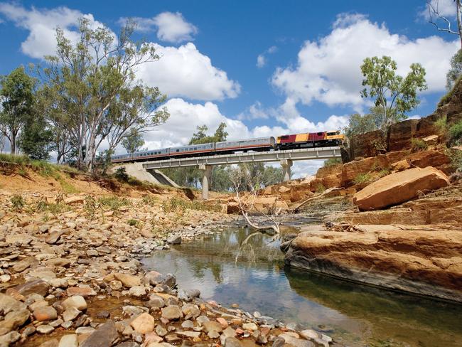 The Spirit of the Outback seen crossing a bridge in Queensland’s outback. Picture: Queensland Rail Travel