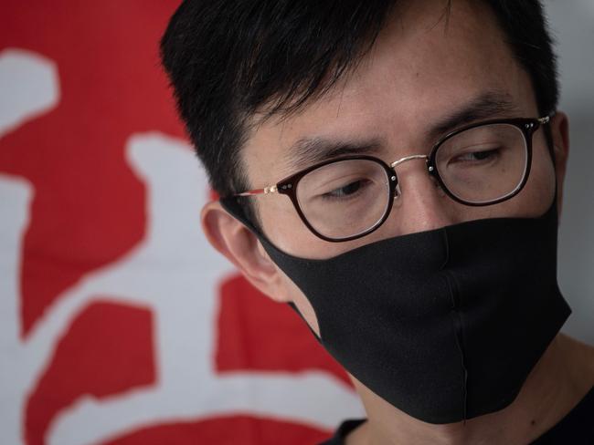 Pro-democracy activist Avery Ng wears a mask as pro-democracy politicians gather outside Hong Kong's High Court for a judicial challenge against a face mask ban. Picture: AFP