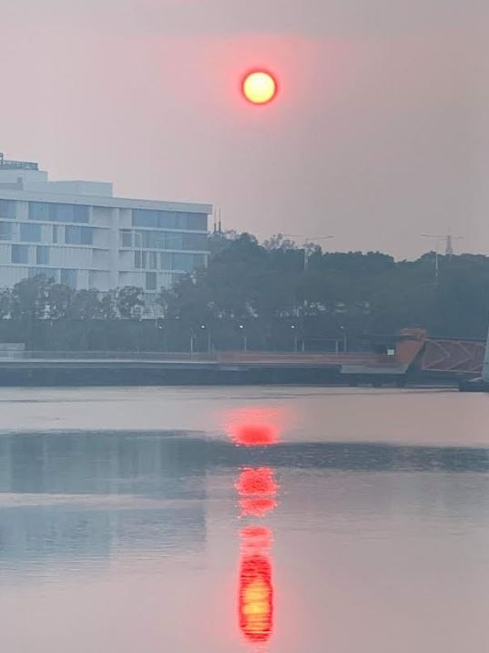 A blood sun seen through the smoke haze over South Bank. Picture: Sarah Vandersee