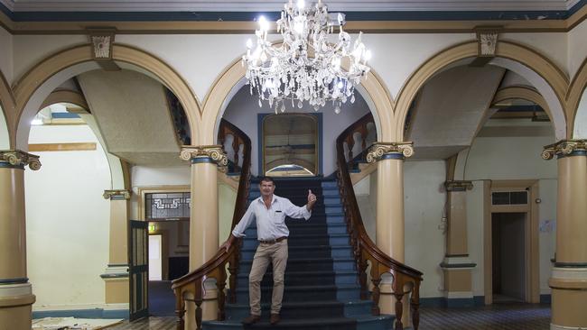 Real estate agent Matt Mercer on the famous grand stairs before the Royal Hotel renovations started.