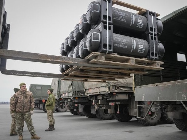 Ukrainian soldiers load Javelin antitank missiles into a military trucks at Boryspil airport, outside Kyiv. Picture: Efrem Lukatsky/AP/WSJ