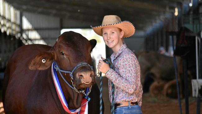 Rockhampton Agricultural Show Supreme Champion Bull Bilo High Commando with leader Candice Rideout. Picture: Geordi Offord