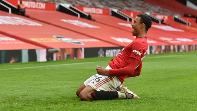 Manchester United's English striker Mason Greenwood celebrates after scoring a goal during the English Premier League football match between Manchester United and Bournemouth at Old Trafford in Manchester, north west England, on July 4, 2020. (Photo by PETER POWELL / POOL / AFP) / RESTRICTED TO EDITORIAL USE. No use with unauthorized audio, video, data, fixture lists, club/league logos or 'live' services. Online in-match use limited to 120 images. An additional 40 images may be used in extra time. No video emulation. Social media in-match use limited to 120 images. An additional 40 images may be used in extra time. No use in betting publications, games or single club/league/player publications. /