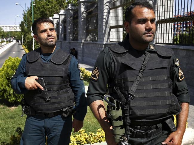 Police patrol outside Iran's parliament building after an assault by several attackers that was claimed by the Islamic State group, in Tehran, Iran.  Picture:  AP