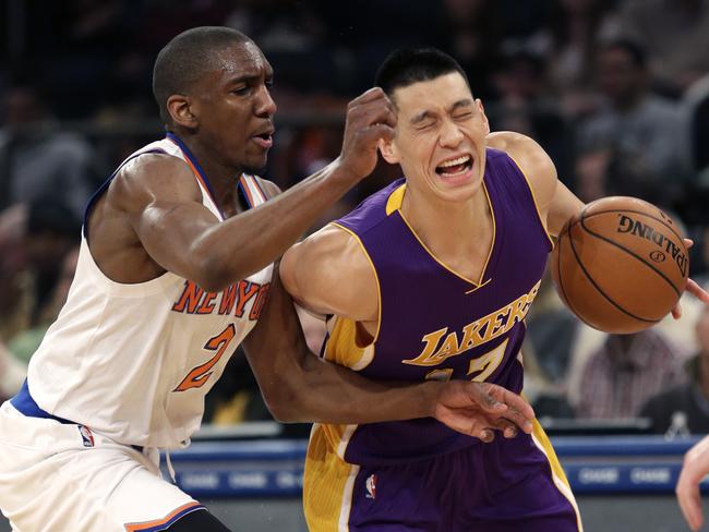 New York Knicks' Langston Galloway, left, fouls Los Angeles Lakers' Jeremy Lin.