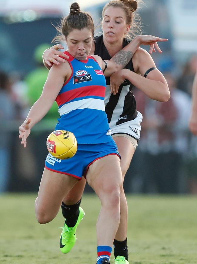 Ellie Blackburn of the Bulldogs is tackled by Emma King of the Magpies during the 2017 AFLW Round 04 match between the Western Bulldogs and Collingwood Magpies. Picture: Getty Images