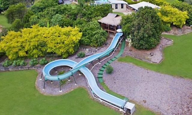 House with waterslide up for sale