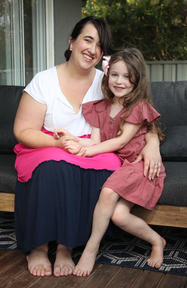 Sara Keli, with her daughter, Olivia, six, supports the new government online safety campaign to teach kids early about online predators. Picture: David Swift.