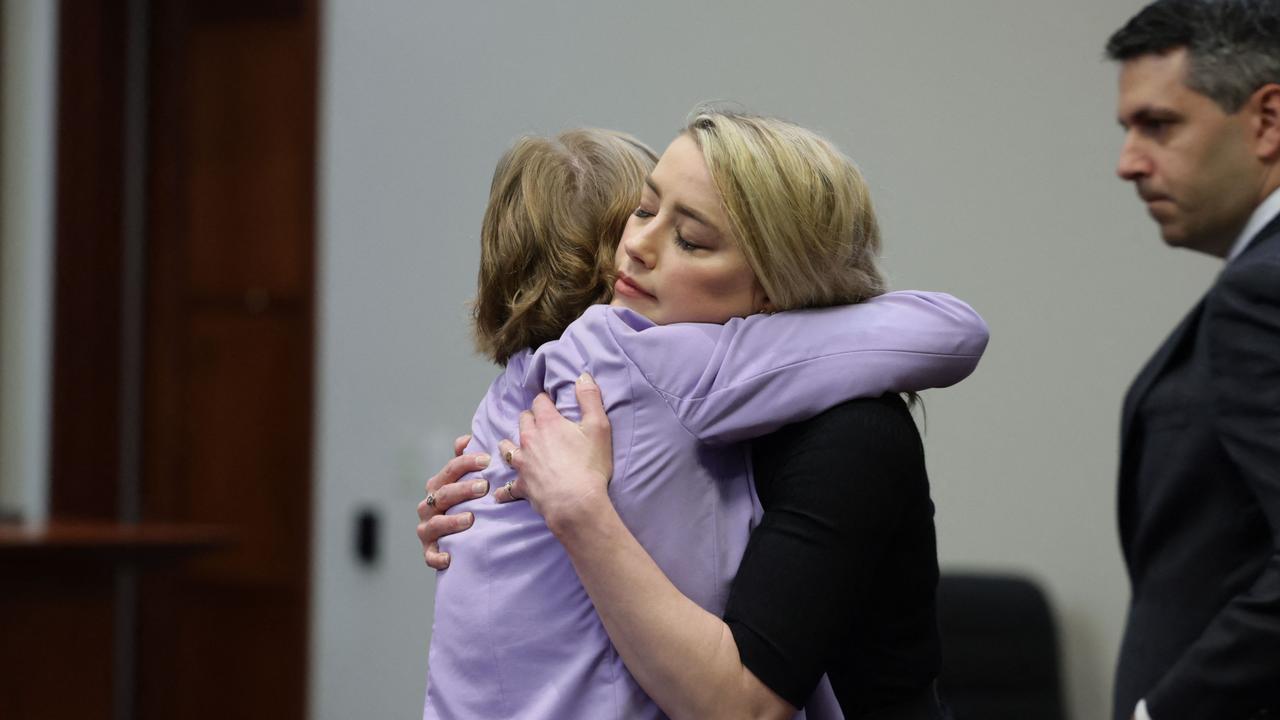 Heard hugs her lawyer Elaine Bredehoft after the jury announced split verdicts mostly in favor of her ex-husband Johnny Depp. Picture: Evelyn Hockstein / AFP.