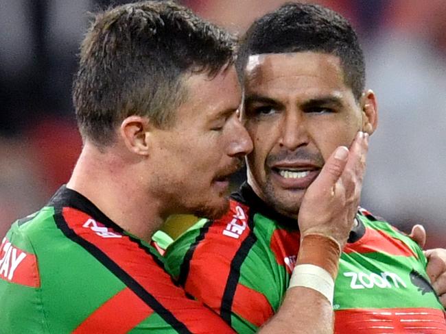 Cody Walker (right) of the Rabbitohs celebrates scoring a try with Damien Cook (left) during the Round 9 NRL match between the South Sydney Rabbitohs and the North Queensland Cowboys at Suncorp Stadium in Brisbane, Sunday, May 12, 2019.  (AAP Image/Darren England) NO ARCHIVING, EDITORIAL USE ONLY