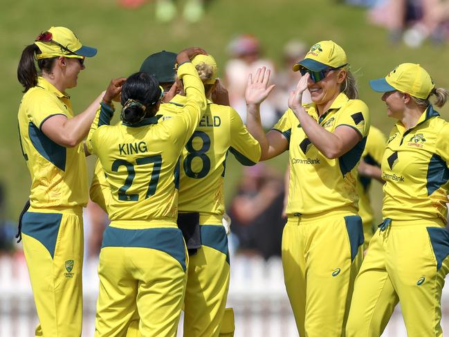 WELLINGTON, NEW ZEALAND - DECEMBER 23: Australia celebrate the wicket of Amelia Kerr of New Zealand during game three of the Women's ODI series between New Zealand and Australia at Basin Reserve, on December 23, 2024, in Wellington, New Zealand. (Photo by Hagen Hopkins/Getty Images)