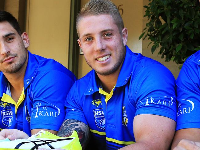 KARI City Origin players L-R Nathan Brown, Ryan Matterson, Aaron Gray and Leilani Latu will make their debut for City on Sunday against the Country side in Tamworth. The boys clean their boots before Sunday's game. Picture: Toby Zerna