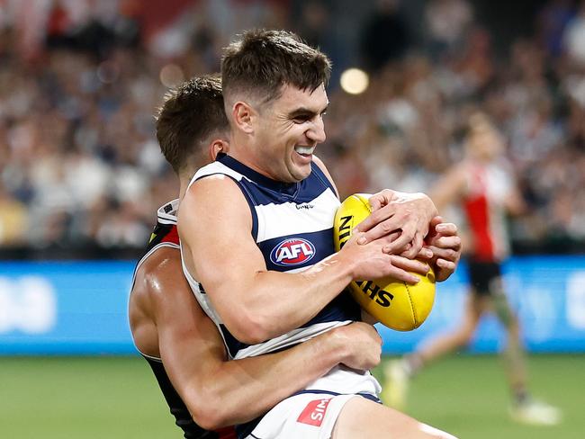 GEELONG, AUSTRALIA - MARCH 16: Shaun Mannagh of the Cats is tackled by Jack Steele of the Saints during the 2024 AFL Round 01 match between the Geelong Cats and the St Kilda Saints at GMHBA Stadium on March 16, 2024 in Geelong, Australia. (Photo by Michael Willson/AFL Photos via Getty Images)