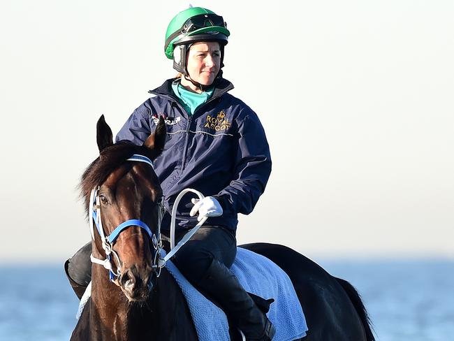 Michelle Payne rides Kaspersky at Altona Beach during his preparation for the Cox Plate.