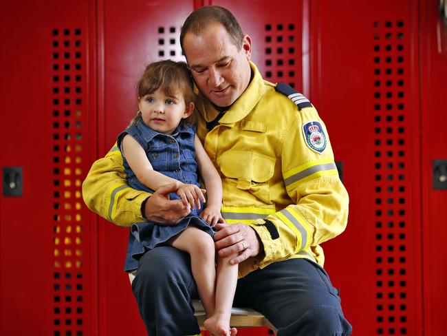 Horsley Park Brigade Captain Darren Nation with Charlotte O’Dwyer, whose dad Andrew was killed in the Black Summer bushfires. Picture: Sam Ruttyn