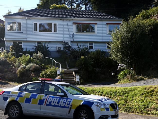 Police presence is seen at the accused gunmans' home in Dunedin, New Zealand. Picture: Getty