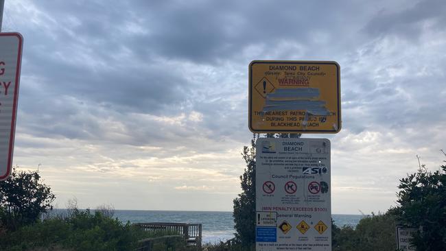 Warning signs located at the entrance to Diamond Beach. Picture: Dan Mills