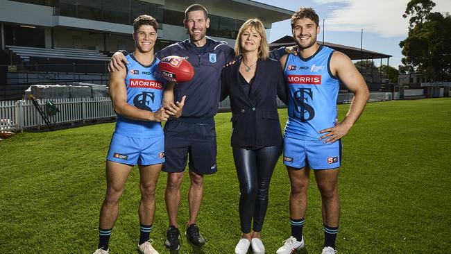 Tom Lewis with coach, Martin Mattner, chief executive Sue Dewing, and James Battersby at Unley Oval, in front of the Sturt Football Club’s $5 million dollar grandstand, in 2023. Picture: Matt Loxton