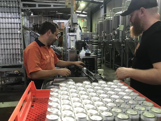 Six String Brewery staff busy canning Mint Condition for the GABS Beer and Cider Festival.